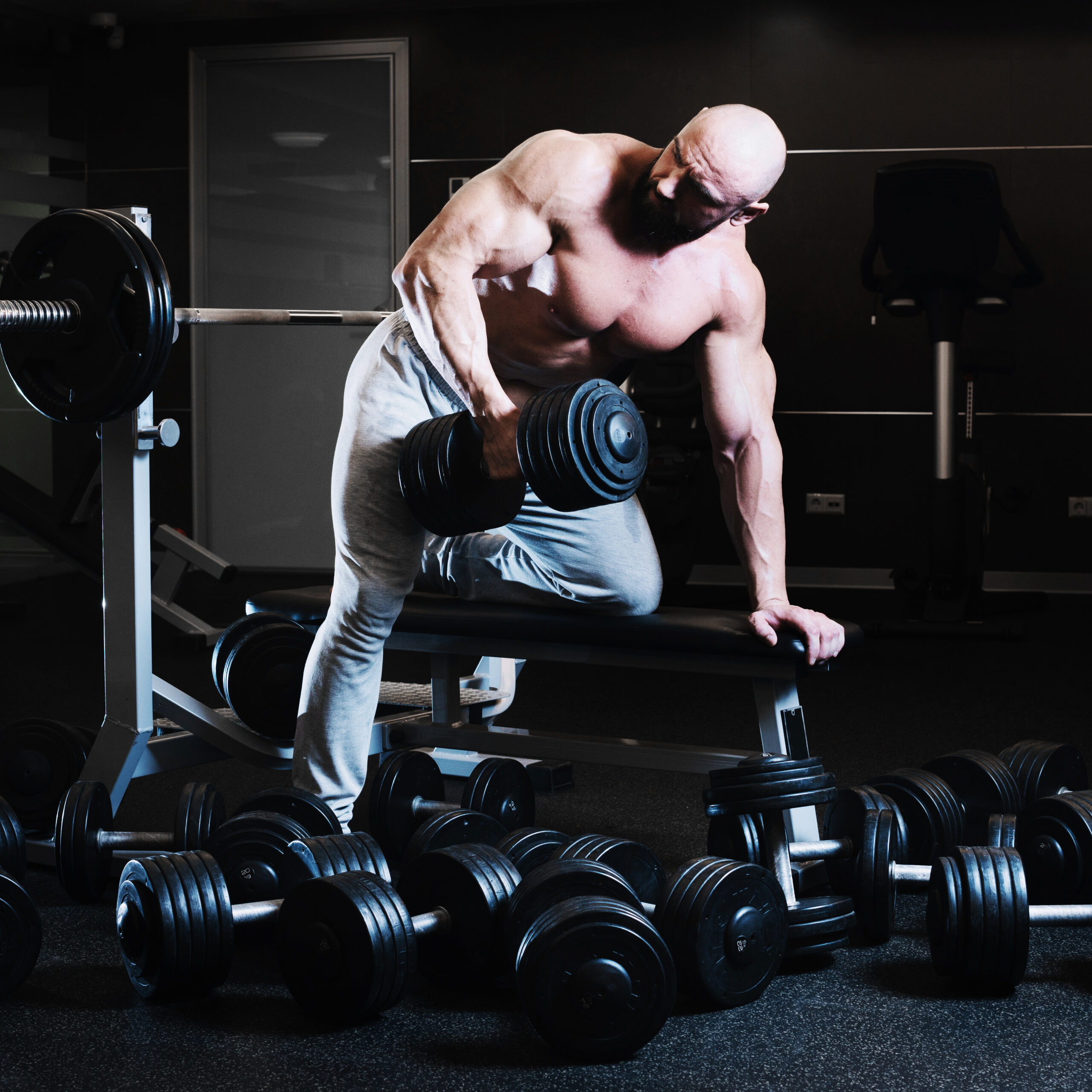 man-with-dumbbell-looking-shoulder